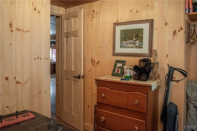 bedroom with wood walls