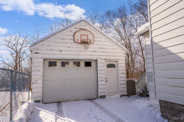 view of snow covered garage