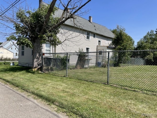 view of home's exterior with a lawn