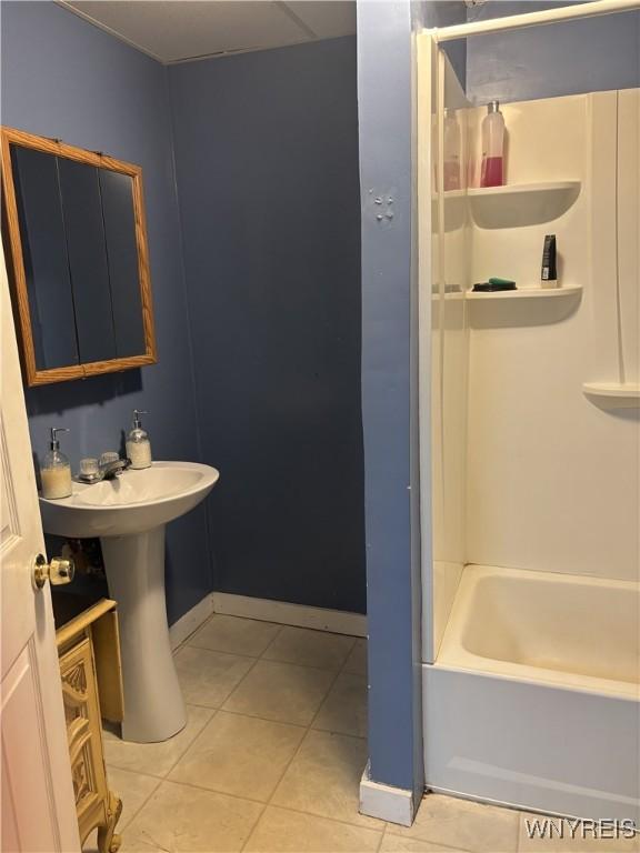 bathroom with tile patterned floors