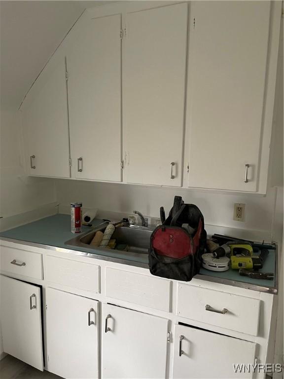 kitchen with white cabinets and sink