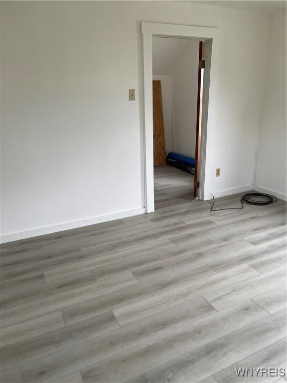 spare room featuring light hardwood / wood-style floors