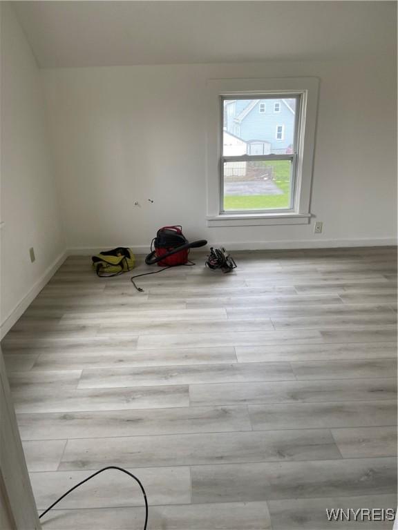 unfurnished room with light hardwood / wood-style flooring