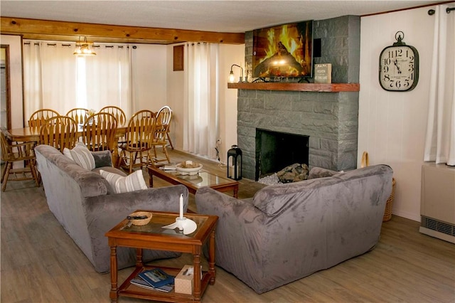 living room with a fireplace and hardwood / wood-style flooring