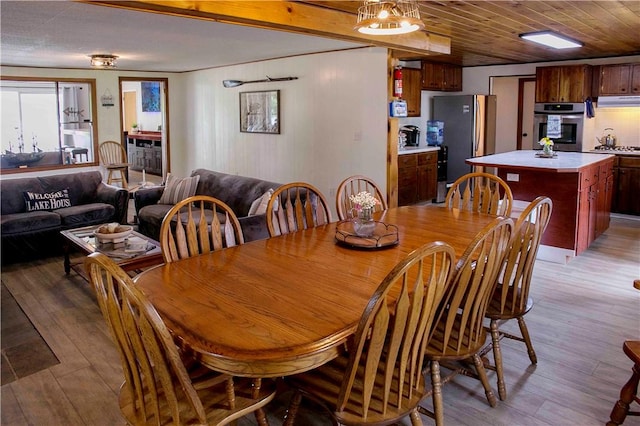 dining space with light hardwood / wood-style flooring