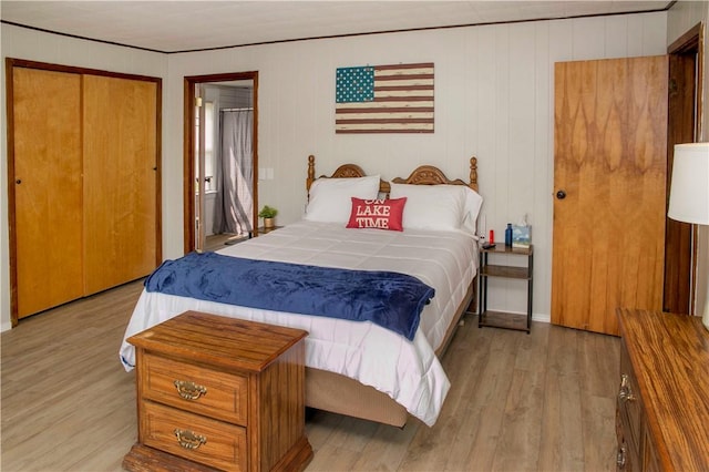 bedroom featuring light wood-type flooring and a closet