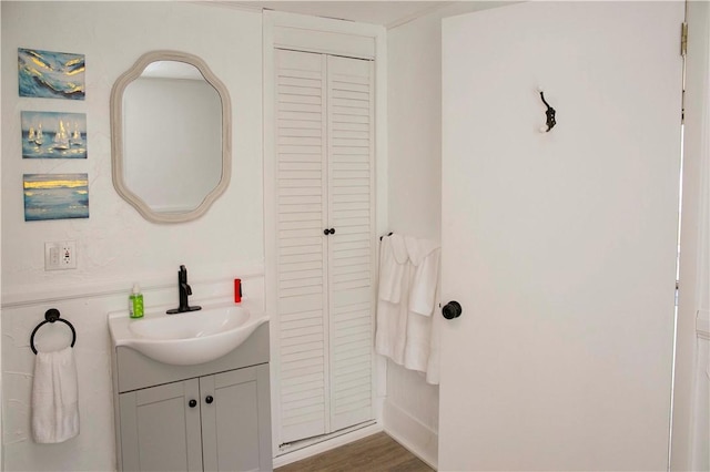 bathroom with hardwood / wood-style flooring and vanity