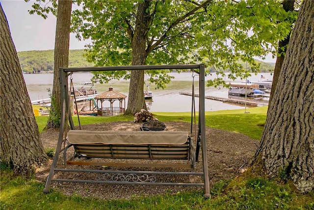 view of community with a water view and a gazebo