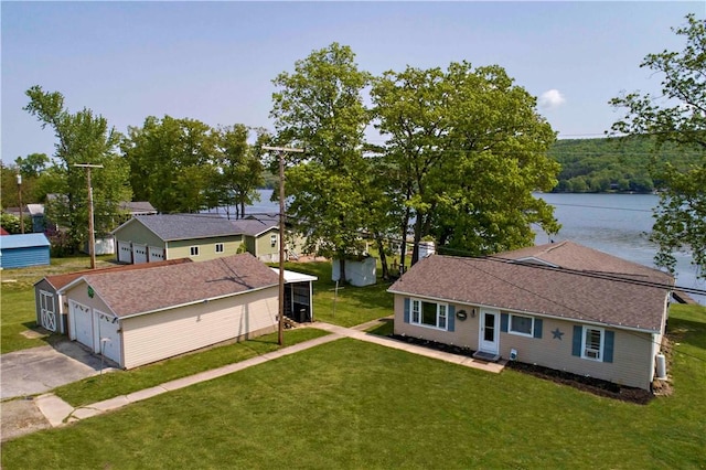 birds eye view of property with a water view