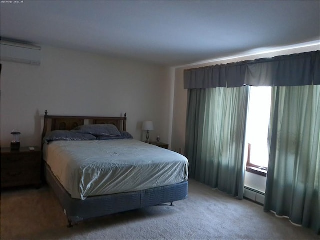 bedroom with carpet, a baseboard heating unit, and a wall unit AC