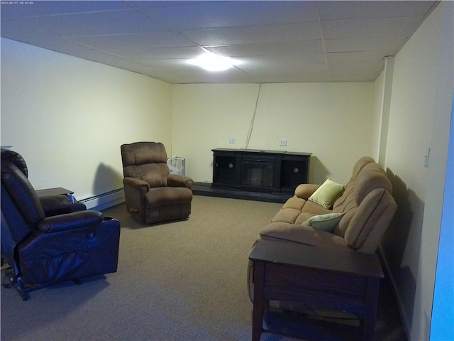 carpeted living room featuring a paneled ceiling and a baseboard heating unit