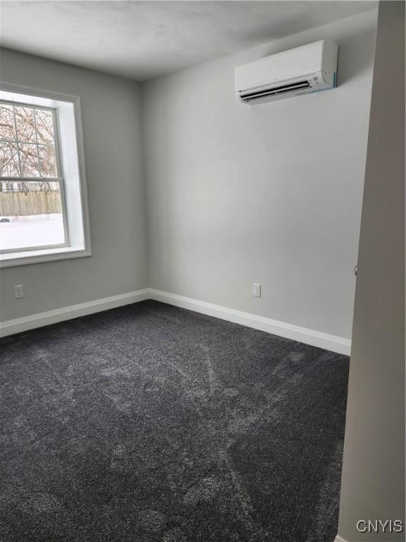 carpeted empty room featuring a wall mounted air conditioner