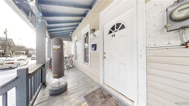 entrance to property featuring covered porch