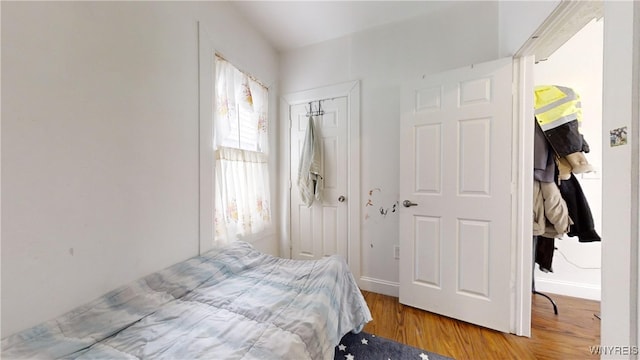 bedroom featuring a closet and wood-type flooring