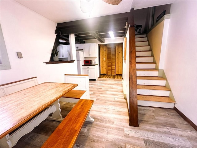 dining space with light hardwood / wood-style flooring