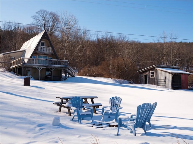 exterior space with a wooden deck and an outdoor structure