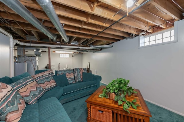 living room with carpet flooring, water heater, and a healthy amount of sunlight