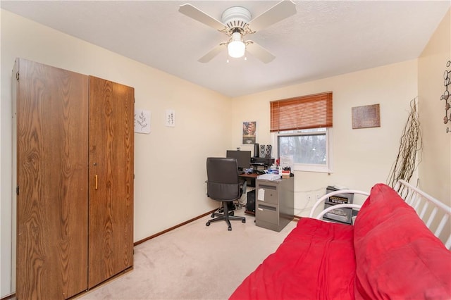 office area featuring ceiling fan and light colored carpet