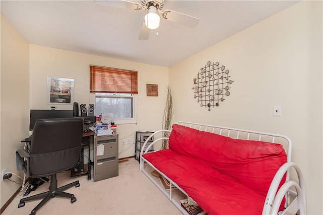 office space with ceiling fan and carpet