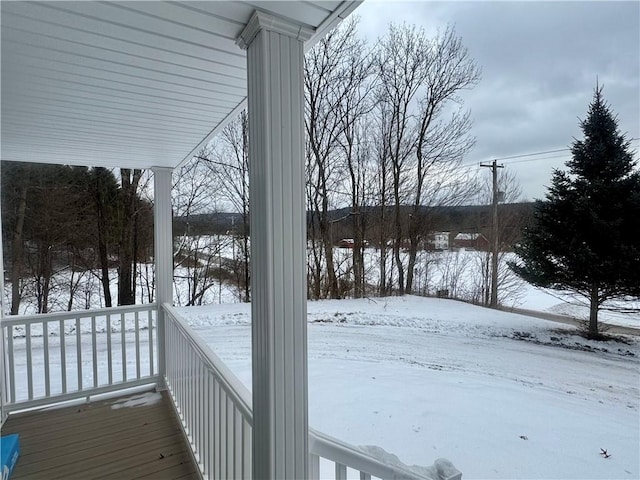 view of snow covered deck