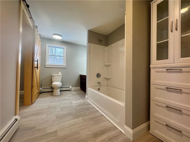 full bathroom featuring a baseboard radiator, hardwood / wood-style floors, vanity, shower / washtub combination, and toilet