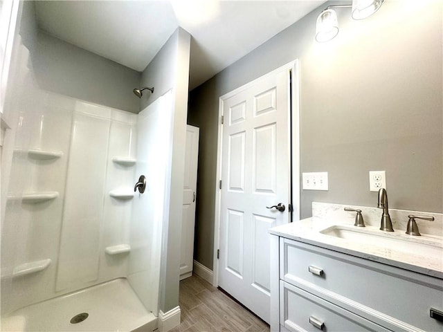 bathroom with vanity and walk in shower