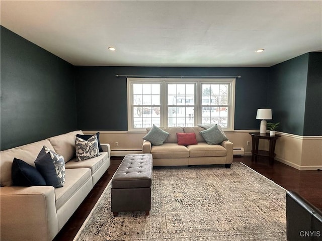 living room featuring dark wood-type flooring and a baseboard radiator