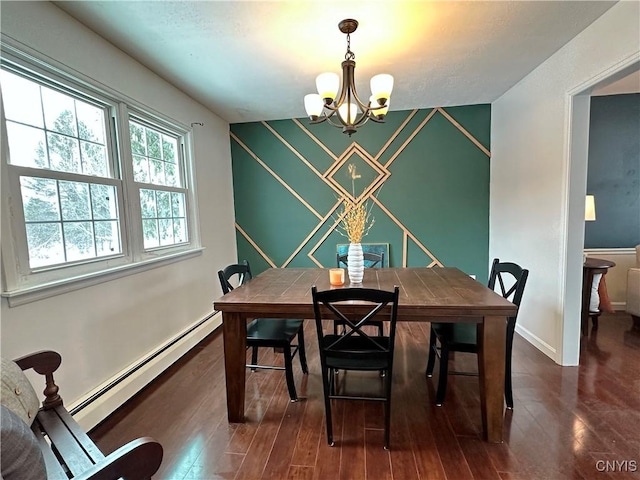 dining space with a baseboard heating unit, dark hardwood / wood-style flooring, and a notable chandelier