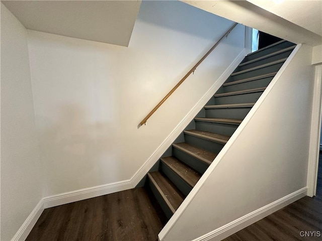 stairway featuring hardwood / wood-style floors