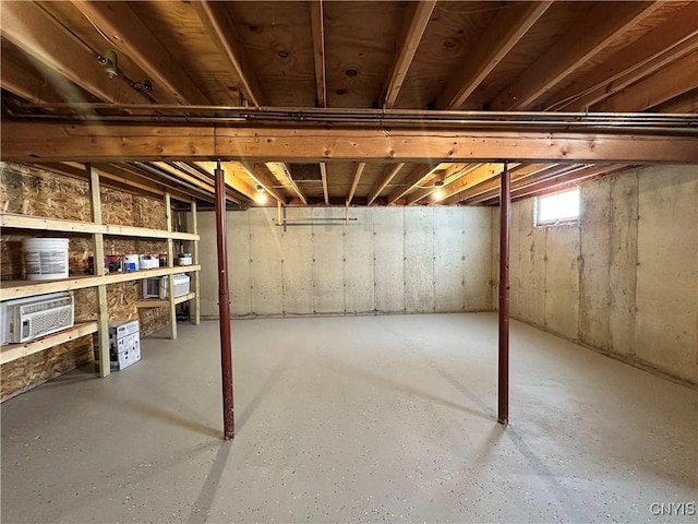 basement with a wall mounted AC