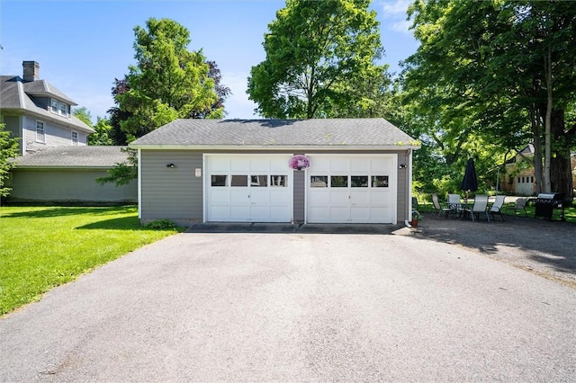 garage with a yard