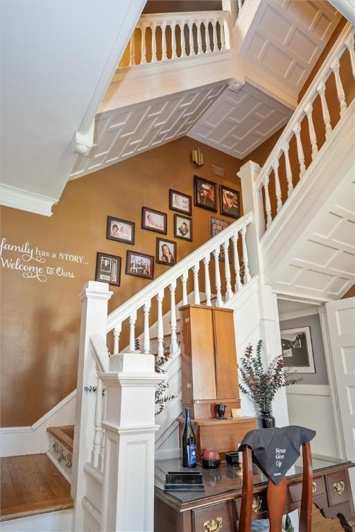 staircase featuring lofted ceiling