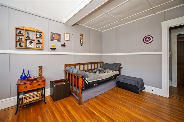 bedroom with hardwood / wood-style flooring