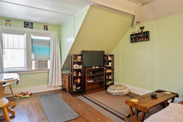 interior space featuring hardwood / wood-style floors and cooling unit