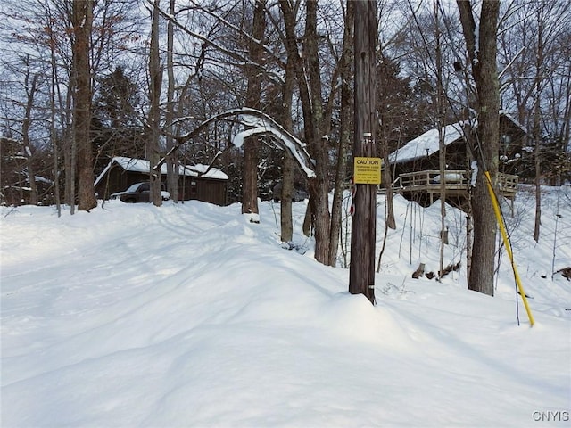 view of yard layered in snow