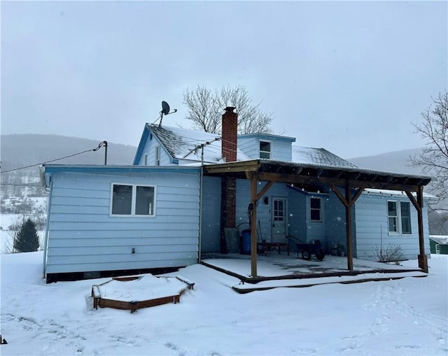 view of snow covered house