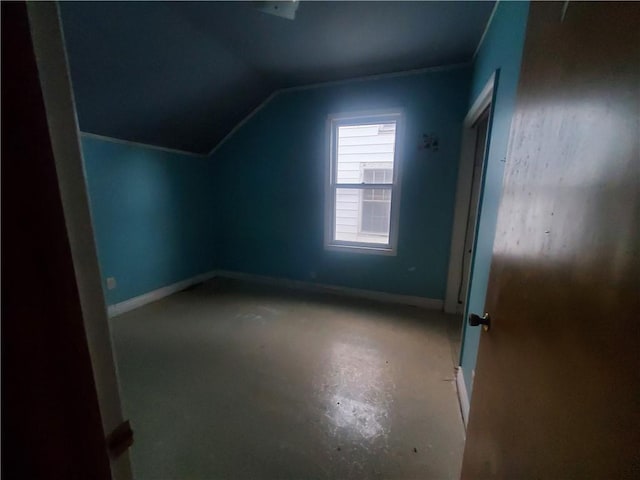 additional living space with vaulted ceiling