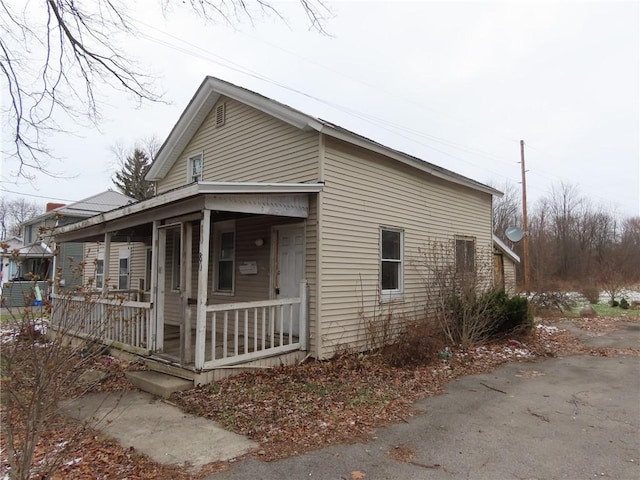 view of home's exterior with covered porch