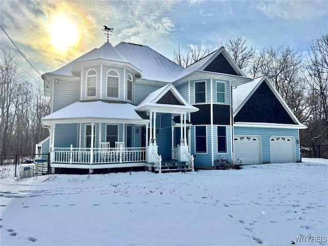 victorian house featuring a garage