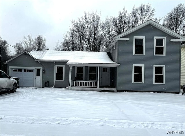 view of front property with a garage and covered porch