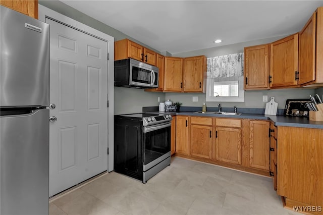 kitchen with appliances with stainless steel finishes and sink