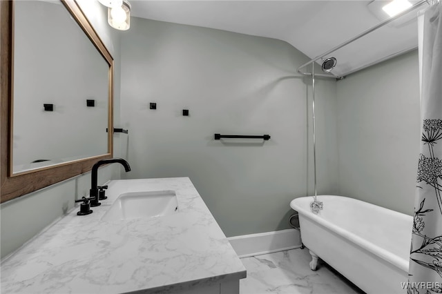 bathroom with vanity and vaulted ceiling