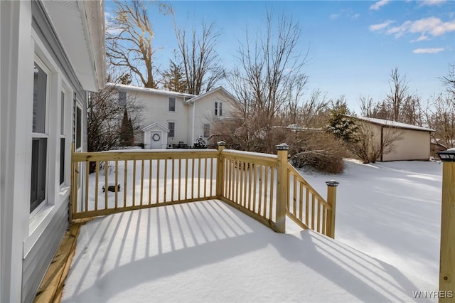 view of snow covered deck