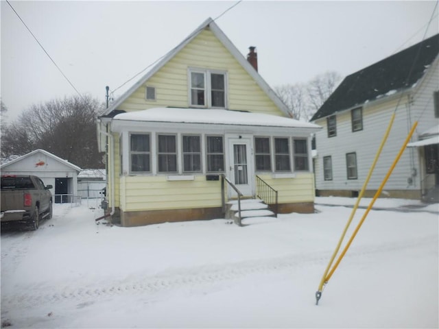 view of front of home featuring a sunroom