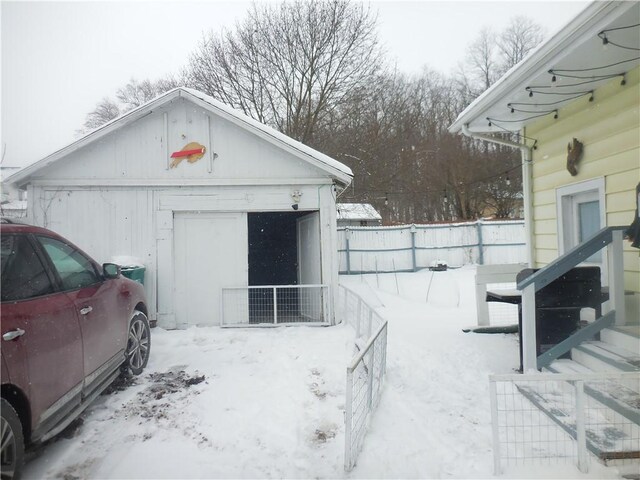 view of snow covered garage