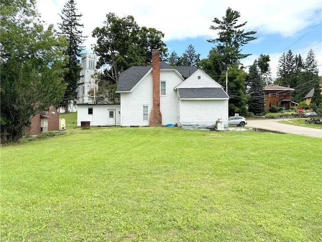 view of home's exterior with a lawn