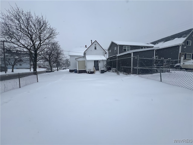 view of yard layered in snow