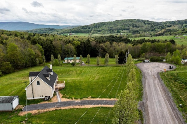 birds eye view of property featuring a mountain view