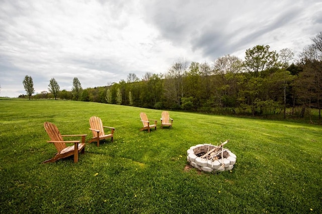 view of yard with a fire pit