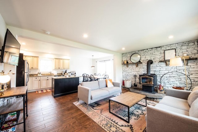 living room with a wood stove and dark hardwood / wood-style floors